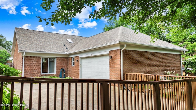 509 Oak Branch Rd, Louisville, KY 40245 - view of property exterior with brick siding, a garage, and roof with shingles
