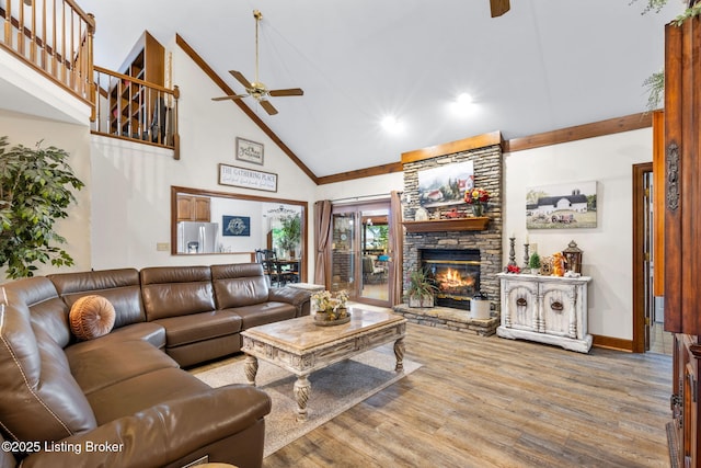 509 Oak Branch Rd, Louisville, KY 40245 - living room with a ceiling fan, high vaulted ceiling, a stone fireplace, wood finished floors, and recessed lighting