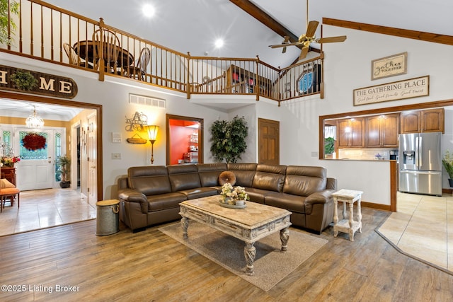 509 Oak Branch Rd, Louisville, KY 40245 - living room featuring high vaulted ceiling, light wood-type flooring, a ceiling fan, beamed ceiling, and stairway