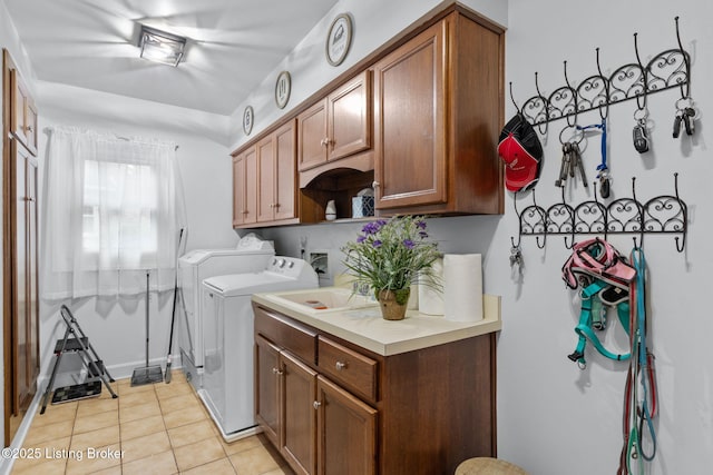 509 Oak Branch Rd, Louisville, KY 40245 - laundry room featuring separate washer and dryer, light tile patterned flooring, and cabinet space