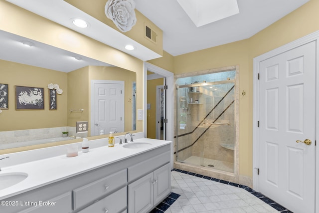 509 Oak Branch Rd, Louisville, KY 40245 - full bath with a skylight, a marble finish shower, double vanity, tile patterned floors, and a bath