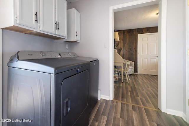 469 Ardmore Ln, Shelbyville, KY 40065 - washroom with cabinet space, washing machine and clothes dryer, dark wood-style flooring, and wooden walls