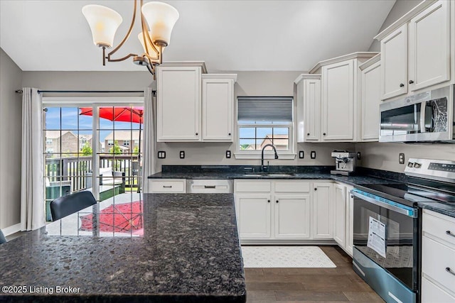 1105 Deer Fields Trce, La Grange, KY 40031 - kitchen featuring stainless steel appliances, dark wood-style floors, white cabinetry, and a chandelier