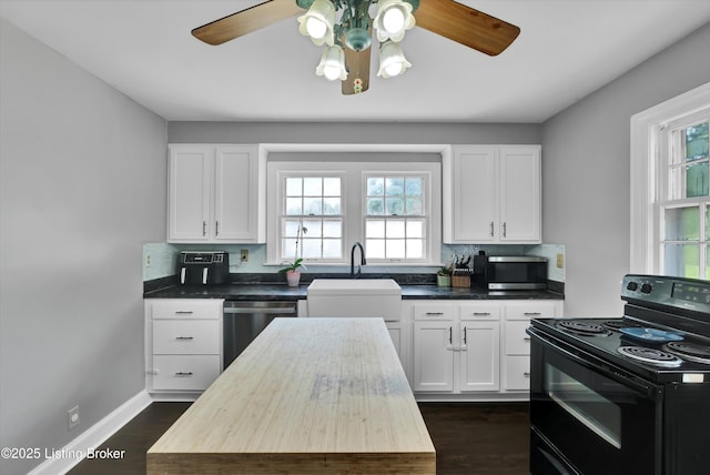 7248 Beechland Ave, Louisville, KY 40258 - kitchen featuring appliances with stainless steel finishes, plenty of natural light, backsplash, and white cabinets