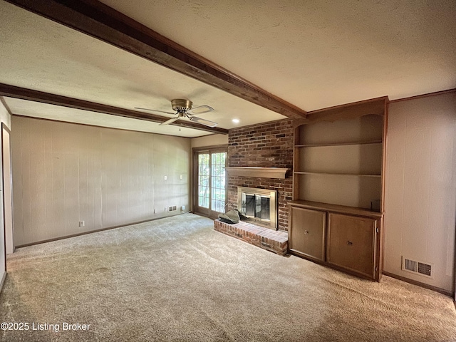 2804 Creekside Dr, Louisville, KY 40241 - unfurnished living room featuring beam ceiling, carpet floors, a textured ceiling, a brick fireplace, and ceiling fan