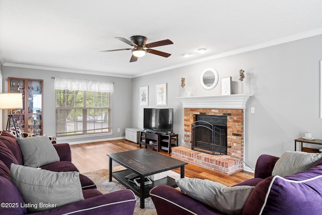 1403 Cadence Ct, Louisville, KY 40222 - living room with a ceiling fan, crown molding, wood finished floors, and a brick fireplace