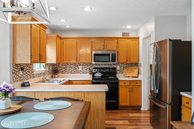 1403 Cadence Ct, Louisville, KY 40222 - kitchen with appliances with stainless steel finishes, light countertops, a peninsula, dark wood finished floors, and decorative backsplash