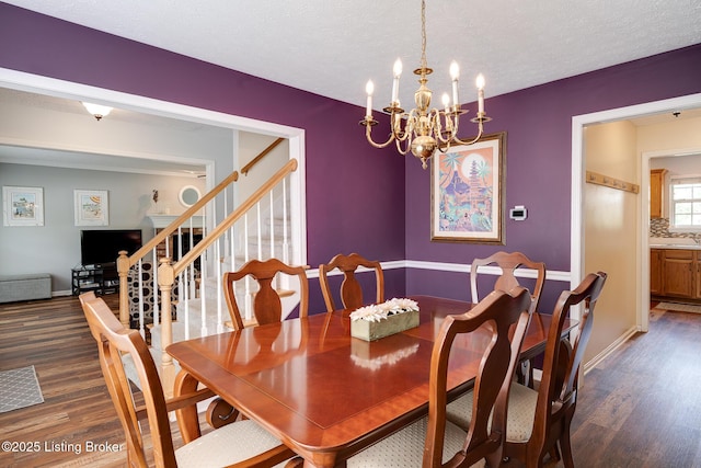 1403 Cadence Ct, Louisville, KY 40222 - dining space featuring dark wood-type flooring, a chandelier, stairs, and a textured ceiling