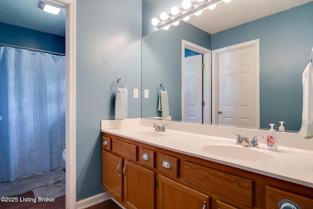1403 Cadence Ct, Louisville, KY 40222 - full bathroom with double vanity and a textured ceiling