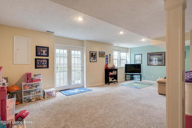 1403 Cadence Ct, Louisville, KY 40222 - living room featuring carpet floors, a textured ceiling, ornate columns, and recessed lighting