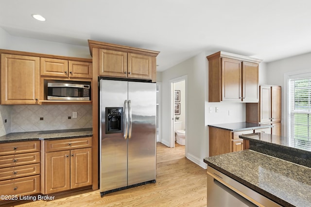 3416 Sasse Way, Louisville, KY 40245 - kitchen featuring stainless steel appliances, light wood-type flooring, decorative backsplash, recessed lighting, and dark stone counters