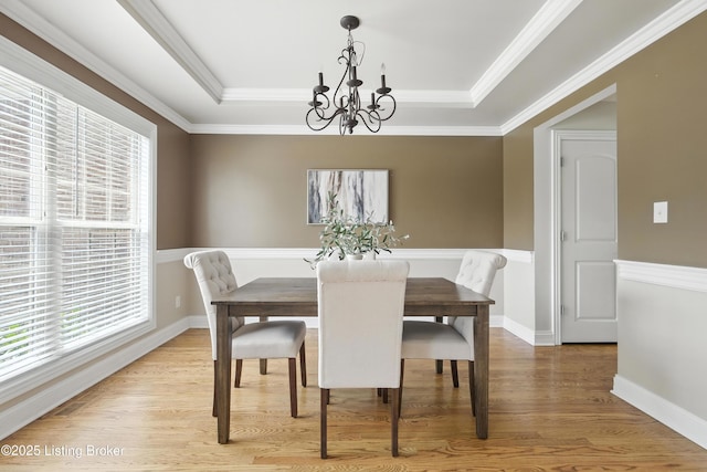 3416 Sasse Way, Louisville, KY 40245 - dining space featuring a chandelier, plenty of natural light, a tray ceiling, light wood-style floors, and crown molding