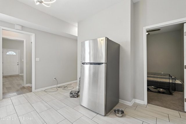 940 Dixie Hwy, Louisville, KY 40210 - kitchen featuring freestanding refrigerator and light wood-style flooring