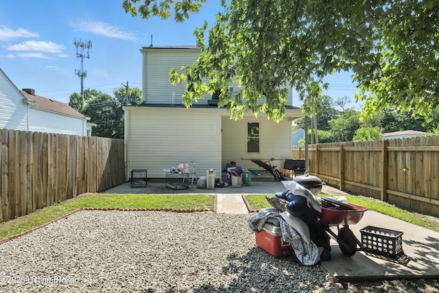 940 Dixie Hwy, Louisville, KY 40210 - rear view of house with a patio area and a fenced backyard