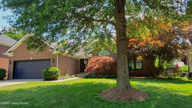 4318 Juniper Forest Pl, Louisville, KY 40245 - view of front of property with an attached garage, brick siding, and concrete driveway