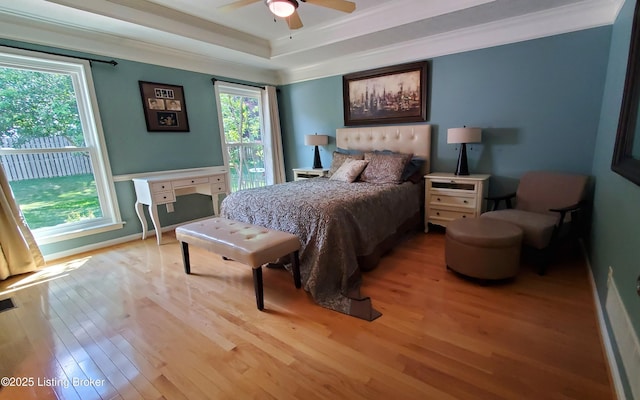 4318 Juniper Forest Pl, Louisville, KY 40245 - bedroom with light wood-style floors, a tray ceiling, crown molding, and a ceiling fan