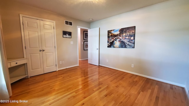 4318 Juniper Forest Pl, Louisville, KY 40245 - unfurnished bedroom with light wood-style flooring and a closet