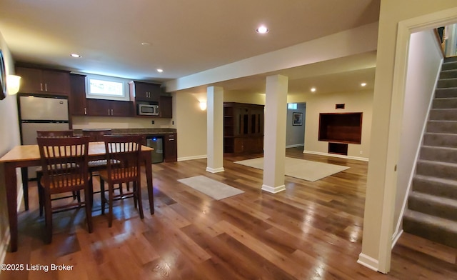 4318 Juniper Forest Pl, Louisville, KY 40245 - dining area featuring stairway, dark wood finished floors, recessed lighting, and bar