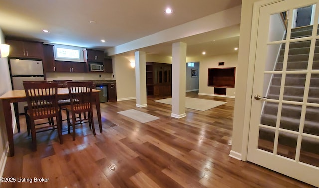4318 Juniper Forest Pl, Louisville, KY 40245 - dining area with dark wood-style flooring, recessed lighting, bar, and decorative columns