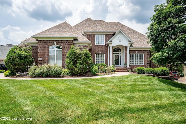 15018 Forest Oaks Dr, Louisville, KY 40245 - traditional home featuring brick siding, a shingled roof, and a front lawn