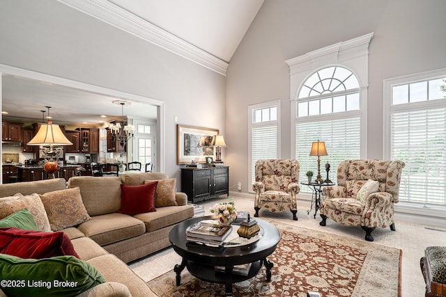 15018 Forest Oaks Dr, Louisville, KY 40245 - living room featuring light colored carpet, high vaulted ceiling, a chandelier, and ornamental molding