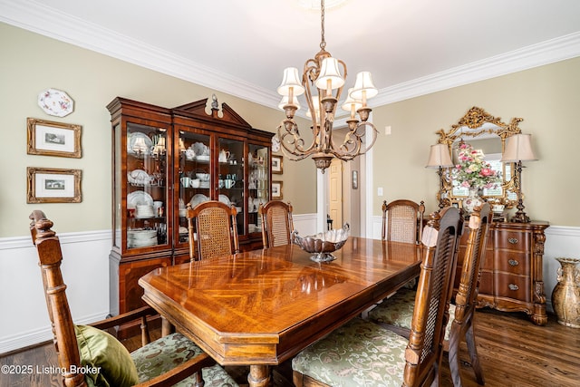 15018 Forest Oaks Dr, Louisville, KY 40245 - dining area featuring a chandelier, wood finished floors, wainscoting, and crown molding