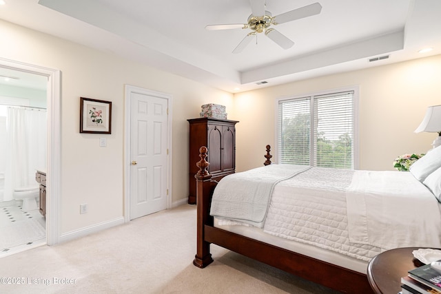 15018 Forest Oaks Dr, Louisville, KY 40245 - bedroom with light carpet, a tray ceiling, ensuite bath, ceiling fan, and recessed lighting