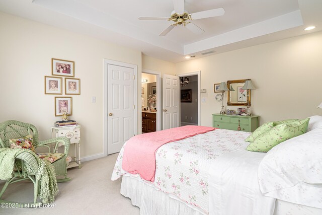 15018 Forest Oaks Dr, Louisville, KY 40245 - bedroom with light carpet, a tray ceiling, recessed lighting, connected bathroom, and ceiling fan