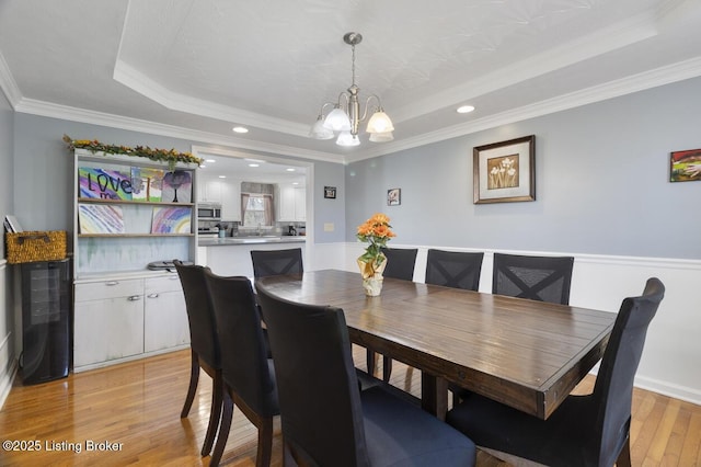 236 Running Creek Dr, Shepherdsville, KY 40165 - dining room with a raised ceiling, a chandelier, light wood-style flooring, recessed lighting, and crown molding
