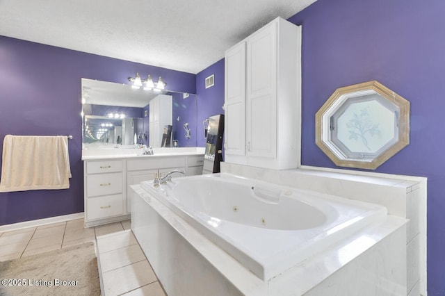 236 Running Creek Dr, Shepherdsville, KY 40165 - full bath with tile patterned floors, vanity, a jetted tub, and a textured ceiling