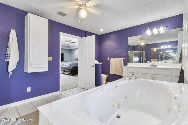 236 Running Creek Dr, Shepherdsville, KY 40165 - ensuite bathroom featuring ceiling fan, a jetted tub, and tile patterned flooring