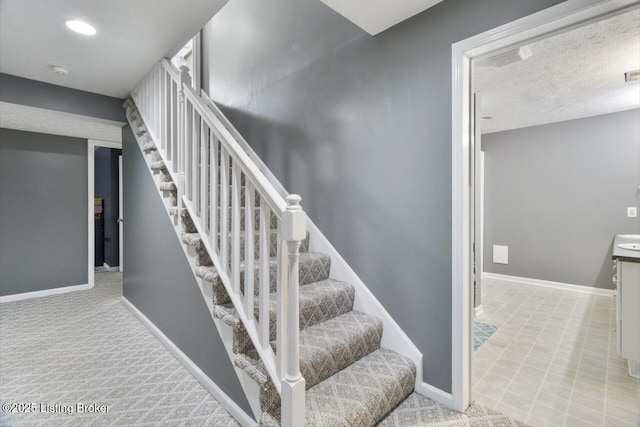 236 Running Creek Dr, Shepherdsville, KY 40165 - staircase featuring carpet and a textured ceiling