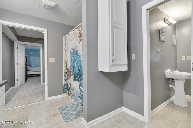 236 Running Creek Dr, Shepherdsville, KY 40165 - bathroom featuring curtained shower and a textured ceiling