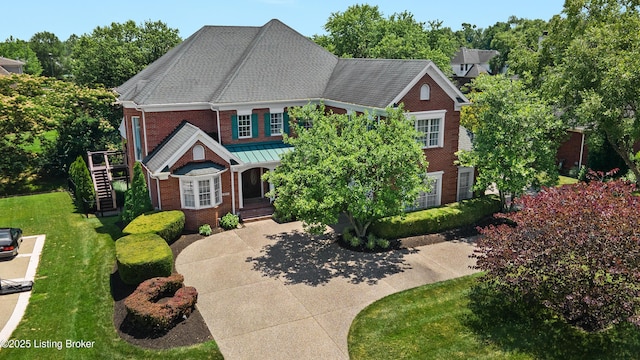 3111 Ridgemoor Ct, Prospect, KY 40059 - view of front of home with brick siding, stairs, a porch, and a front lawn
