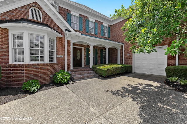 3111 Ridgemoor Ct, Prospect, KY 40059 - view of front of house with concrete driveway, brick siding, and a garage