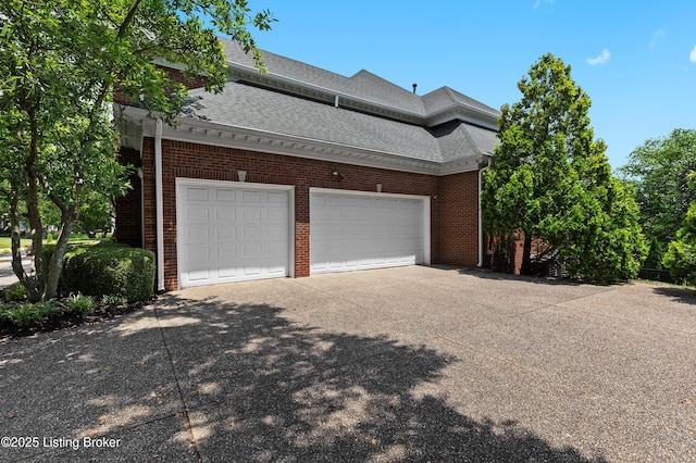 3111 Ridgemoor Ct, Prospect, KY 40059 - view of home's exterior featuring concrete driveway, brick siding, a shingled roof, and a garage