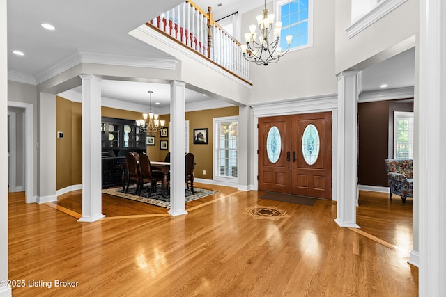 3111 Ridgemoor Ct, Prospect, KY 40059 - entrance foyer featuring decorative columns, a chandelier, light wood-style flooring, and recessed lighting
