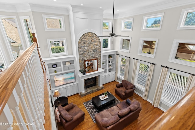 3111 Ridgemoor Ct, Prospect, KY 40059 - living area with a fireplace, crown molding, ceiling fan, wood finished floors, and healthy amount of natural light