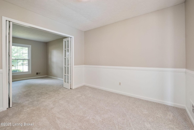 2409 Hayward Rd, Louisville, KY 40242 - empty room with carpet flooring and french doors
