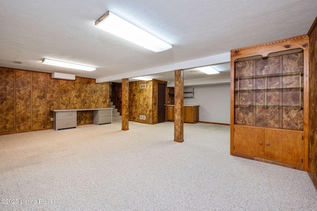 2409 Hayward Rd, Louisville, KY 40242 - finished basement with wooden walls, a textured ceiling, and carpet floors