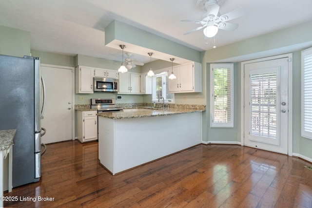 163 Ridgewood Dr, Pewee Valley, KY 40056 - kitchen with stainless steel appliances, dark wood-style floors, white cabinetry, a peninsula, and light stone countertops