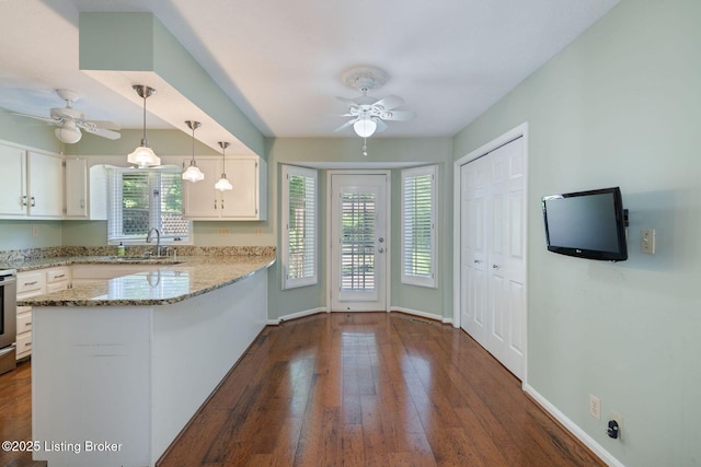 163 Ridgewood Dr, Pewee Valley, KY 40056 - kitchen with ceiling fan, white cabinetry, a peninsula, and light stone counters