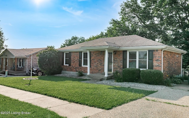 517 Oak Leaf Dr, La Grange, KY 40031 - ranch-style home featuring brick siding, a front lawn, and a shingled roof