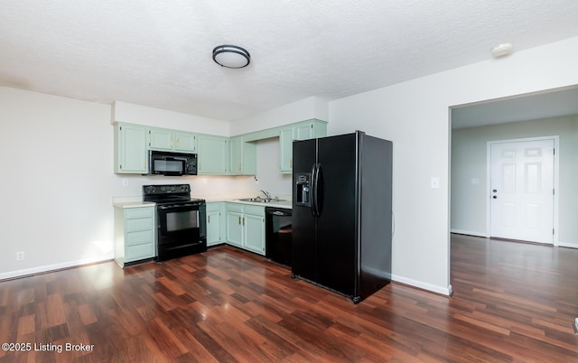 517 Oak Leaf Dr, La Grange, KY 40031 - kitchen with black appliances, light countertops, dark wood-type flooring, and a textured ceiling