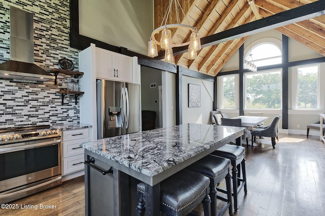 1575 Ochs Ln, Bloomfield, KY 40008 - kitchen with appliances with stainless steel finishes, range hood, light stone countertops, decorative backsplash, and open shelves