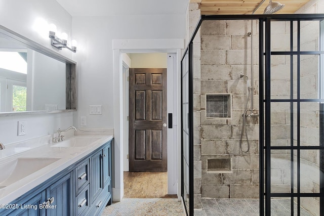 1575 Ochs Ln, Bloomfield, KY 40008 - bathroom featuring double vanity, a shower stall, and wood finished floors