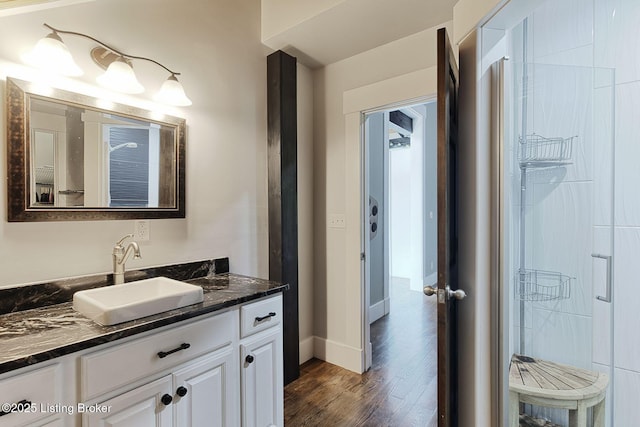 1575 Ochs Ln, Bloomfield, KY 40008 - bathroom featuring wood finished floors, vanity, and a shower