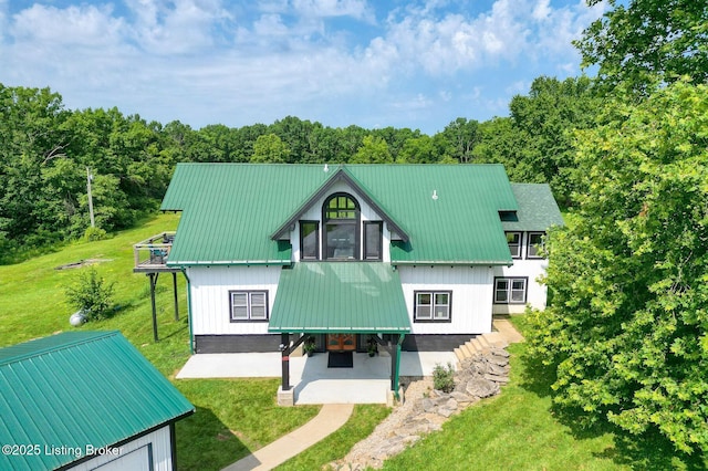 1575 Ochs Ln, Bloomfield, KY 40008 - rear view of property featuring a lawn, a patio, a balcony, and a metal roof