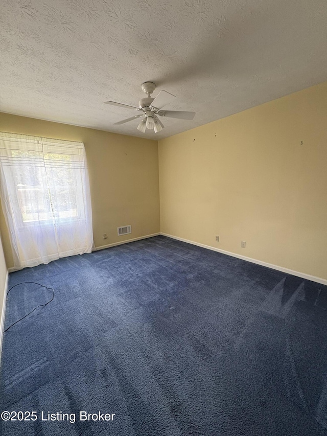 1303 Limestone Trce, Louisville, KY 40223 - empty room featuring a ceiling fan, dark colored carpet, and a textured ceiling