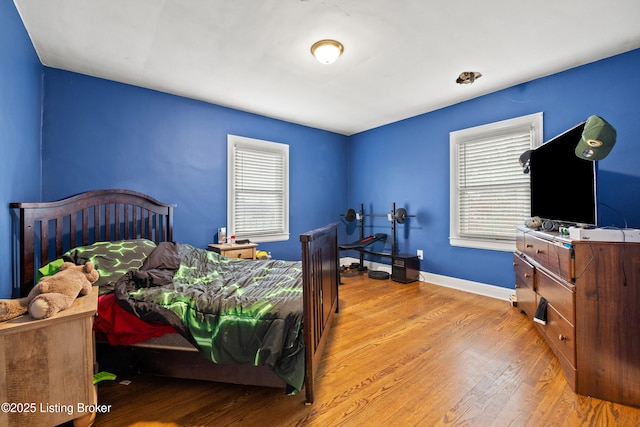 908 Chestnut Ave, Frankfort, KY 40601 - bedroom featuring multiple windows and wood finished floors